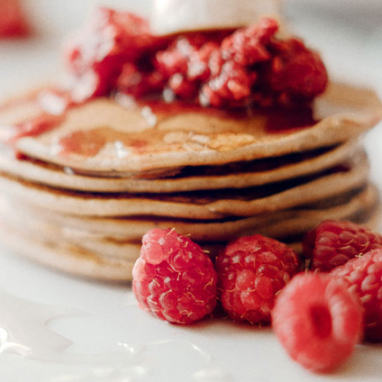 Crêpes with raspberry preserve and white chocolate sauce